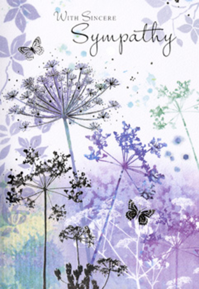 The design of this sympathy card carries the calm of a still morning over Muswell Hill, when the streets are quiet and the air feels washed clean. A cluster of tall, fine-stemmed wildflowers rises from the lower edge of the image, each stem drawn as a slender line that bends and curves with a natural ease. At the top of these stems, delicate umbel-shaped flower heads fan out like tiny lacework, rendered in gentle layers of lavender, muted purple, and hazy blue, touched with hints of silvery green. The petals and florets are more suggested than detailed, as if seen through a soft-focus lens, inviting the gaze to rest rather than scrutinise. Behind them, the background melts into a seamless watercolour field, with cool tones blending like low Muswell Hill clouds after rainfall, shifting from pale violet to bluish grey and sage. The effect is soothing and atmospheric, like standing at a quiet vantage point near Alexandra Park and watching mist roll over the treetops. Two fragile butterflies float above and between the stems, their wings painted in transparent layers of lilac and blue-grey. They are light, almost spectral figures, not meant to dominate but to whisper of transformation and gentle presence. The lighting feels diffused, as though filtered through soft cloud, giving everything a velvety, non-reflective finish that helps the eyes relax. As someone who prepares funeral flowers for local families, I recognise how this card's restrained elegance and nature-inspired palette can offer comfort at memorials around Muswell Hill. It conveys sympathy in a measured, deeply respectful way, accompanying condolence flowers with a quiet assurance that remembrance and care endure long after the service has ended.